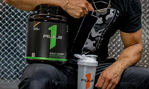 Rule 1 Supplements Man Holding At Gym