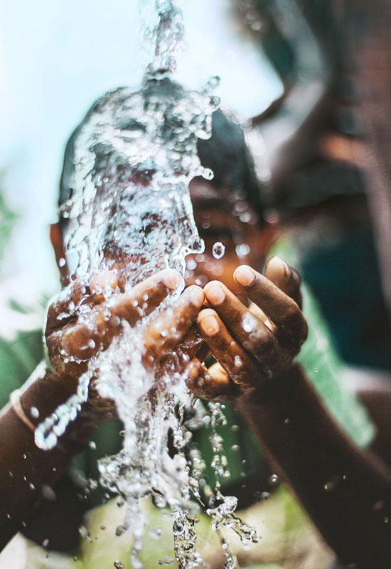 Boy Splashing Clean Water