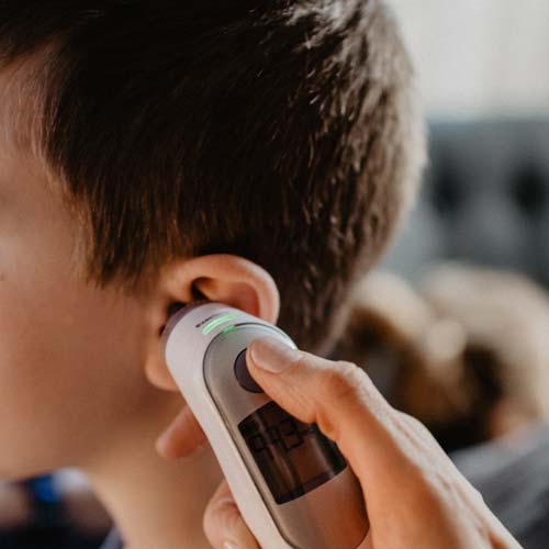 Child's Temperature Check from Mobile Nurse